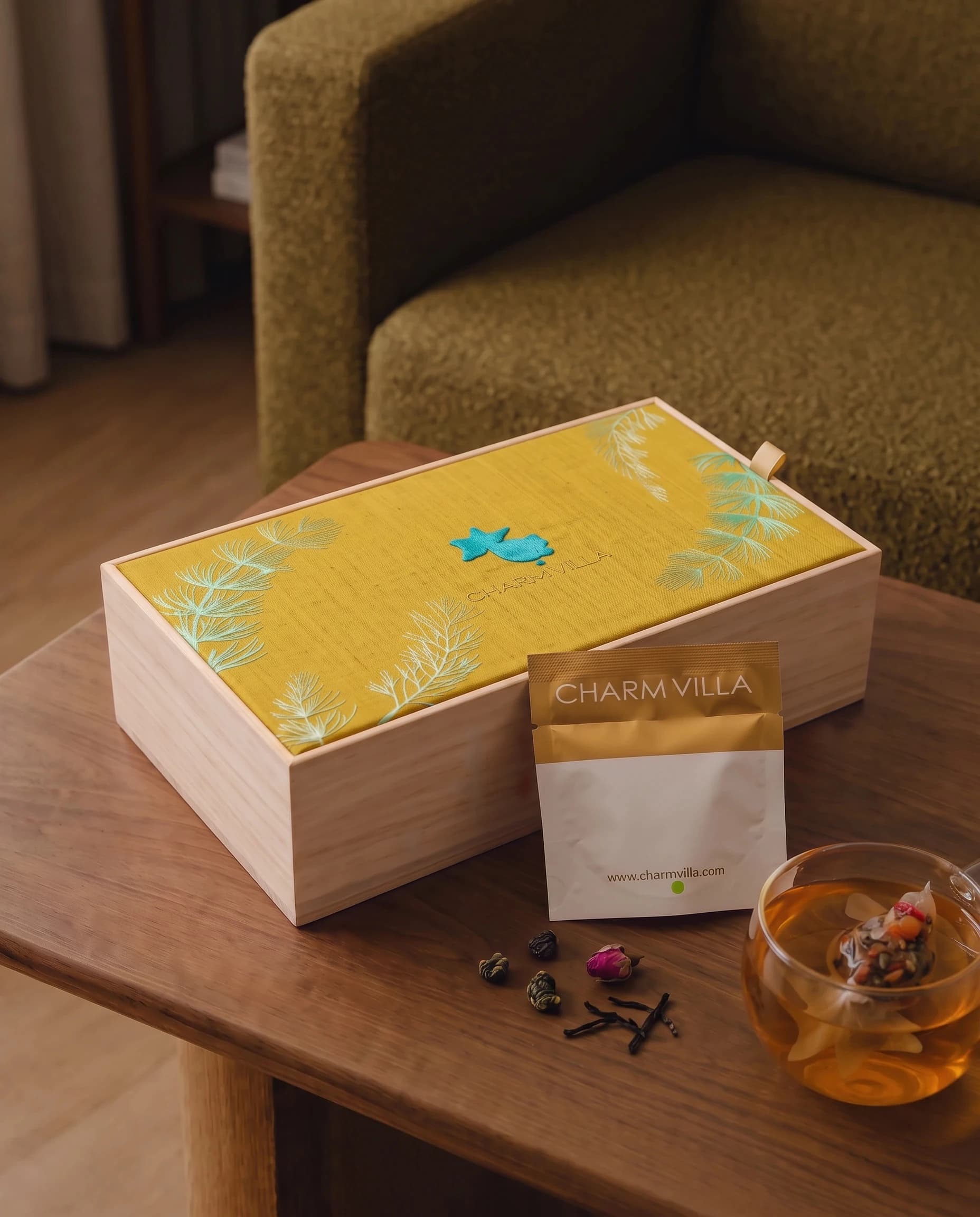The Joyful Reunion gift box with a glass of goldfish tea