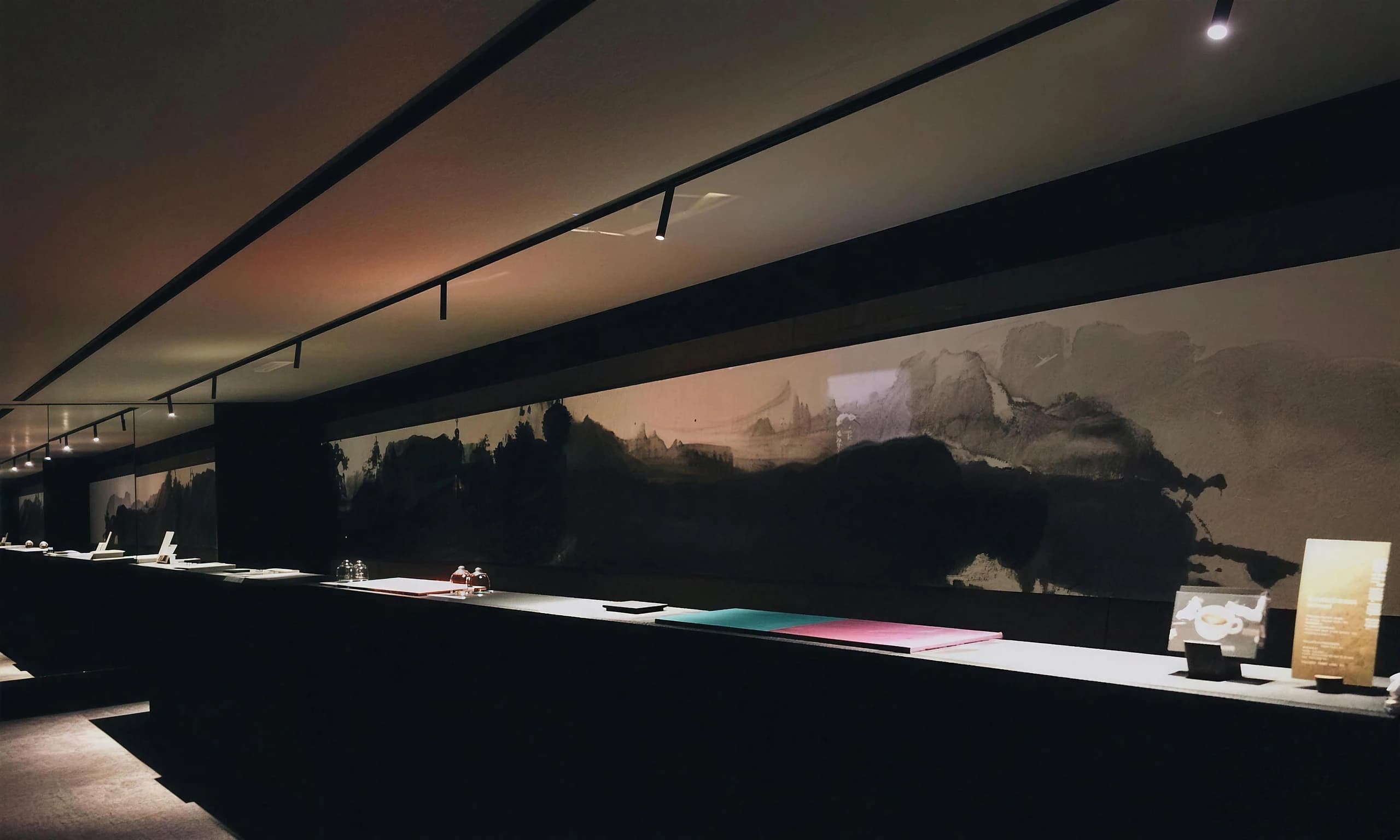 The long table and ink-painting wall of CHARM VILLA in Kyoto